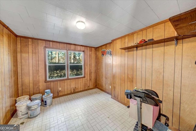 workout room featuring wood walls