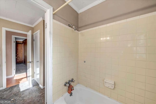 bathroom featuring bathing tub / shower combination and crown molding