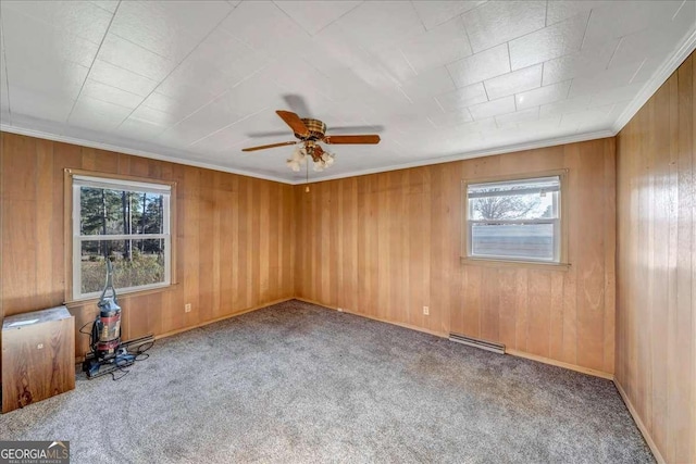 unfurnished room featuring carpet floors, ceiling fan, and crown molding