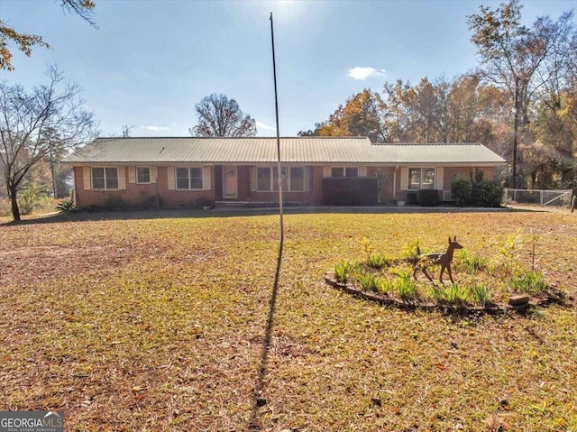 back of property featuring a lawn