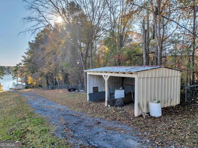 view of outbuilding with a water view