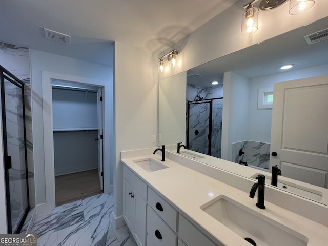 bathroom featuring vanity and a shower with shower door