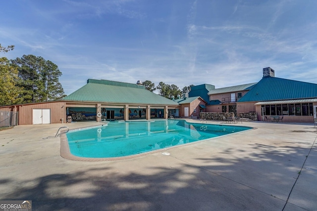 view of swimming pool with a patio area