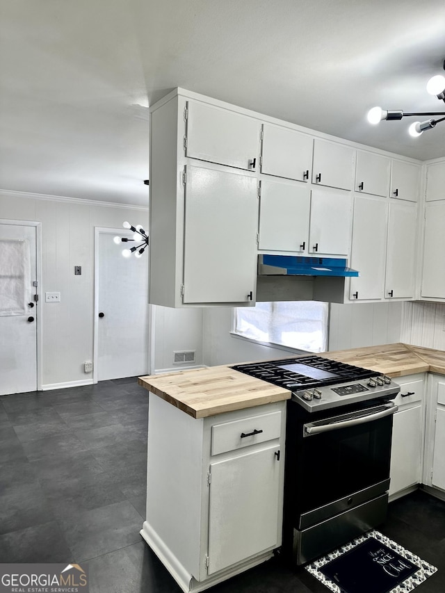 kitchen with visible vents, white cabinetry, gas range, butcher block countertops, and under cabinet range hood