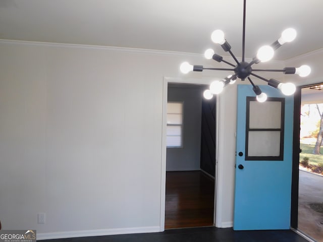 spare room with dark wood-style floors and crown molding