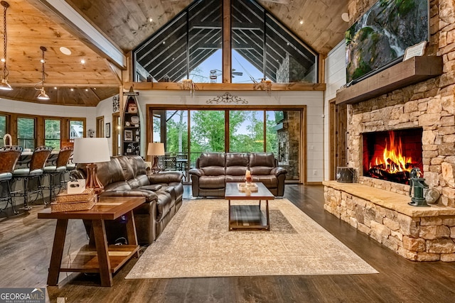 living room featuring wood-type flooring, wooden ceiling, a fireplace, and high vaulted ceiling