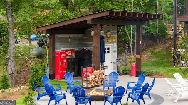 view of patio / terrace featuring a fire pit