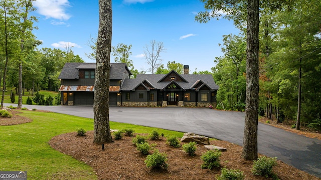 view of front facade with a front yard and a garage