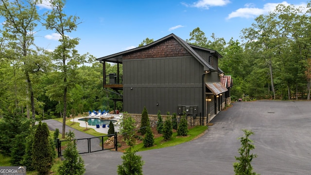 view of home's exterior featuring a balcony