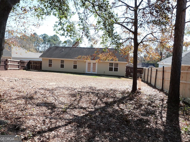 back of house featuring french doors