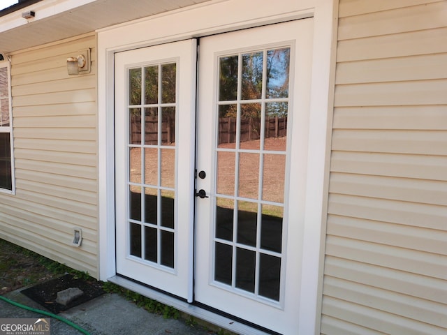 view of exterior entry featuring french doors