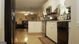 kitchen with white cabinets and kitchen peninsula