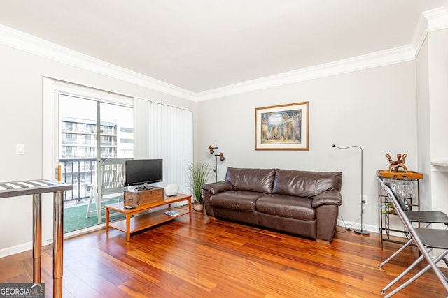 living room featuring crown molding and hardwood / wood-style floors