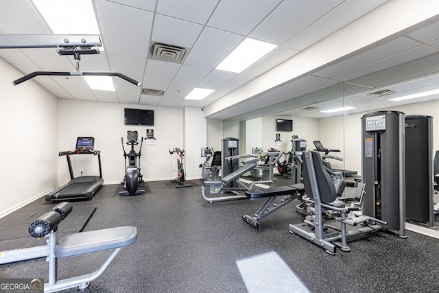 gym featuring a paneled ceiling