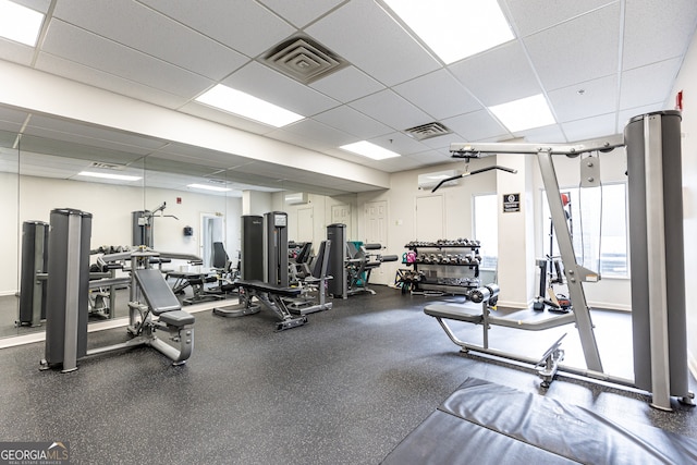 gym featuring a paneled ceiling