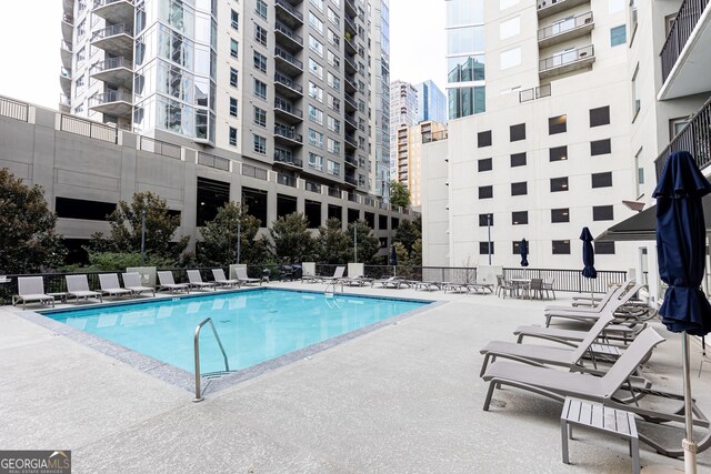 view of swimming pool with a patio area