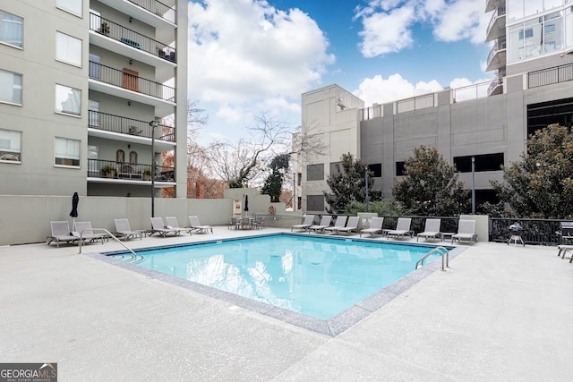 view of swimming pool featuring a patio area