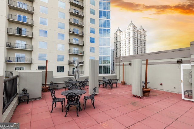 view of patio terrace at dusk