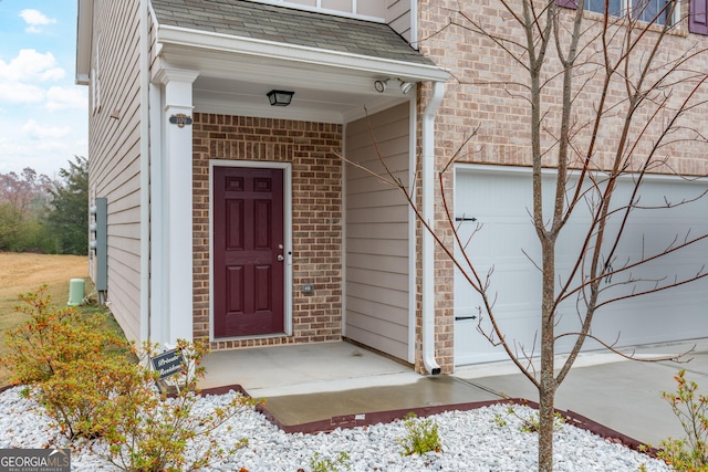 view of exterior entry featuring a garage