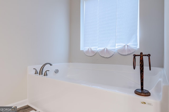 bathroom featuring a tub