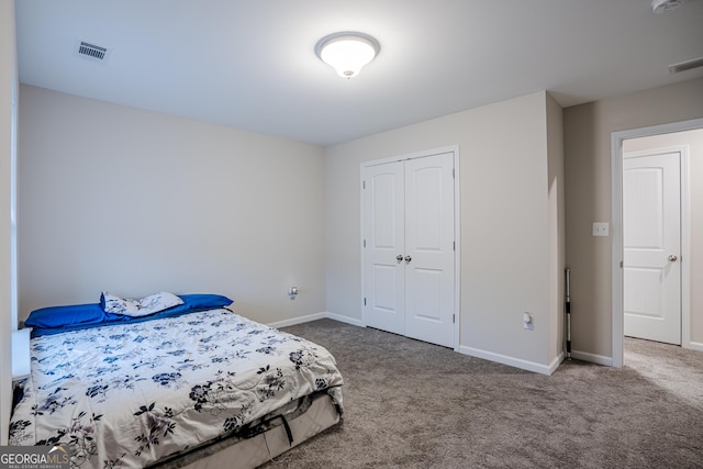 carpeted bedroom featuring a closet