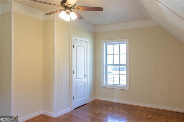 additional living space featuring ceiling fan, wood-type flooring, and vaulted ceiling