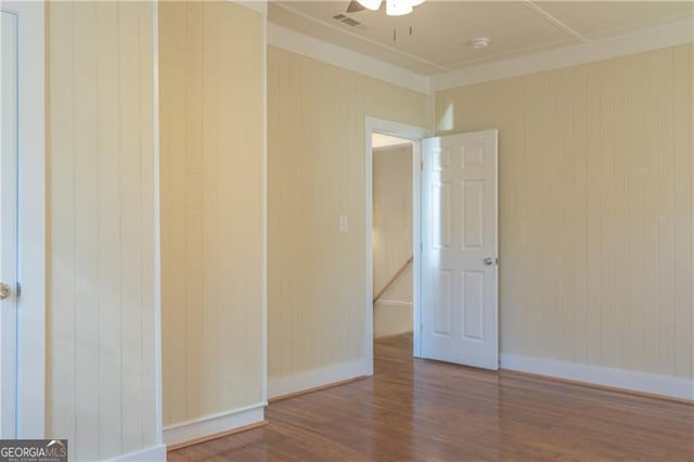 empty room with ceiling fan and wood-type flooring