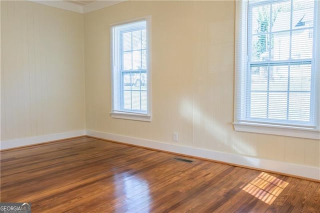 unfurnished room featuring wood-type flooring