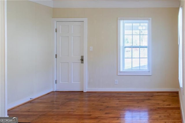 unfurnished room with dark hardwood / wood-style flooring