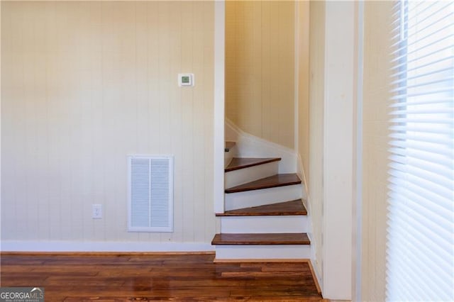 stairway featuring hardwood / wood-style floors