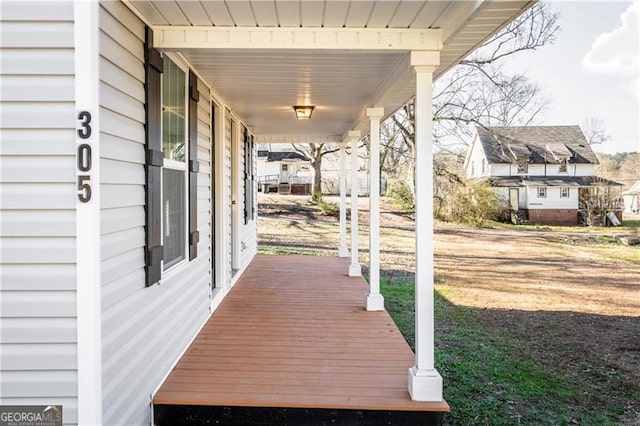 wooden deck featuring covered porch