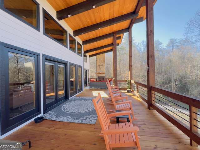 deck featuring french doors and an outdoor hangout area