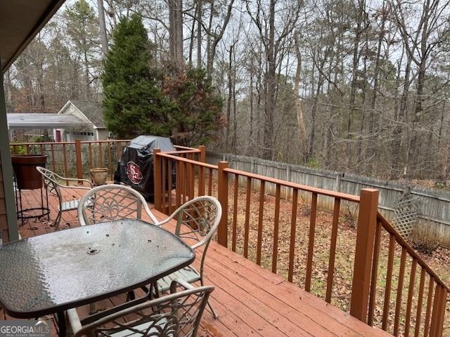 wooden deck with grilling area