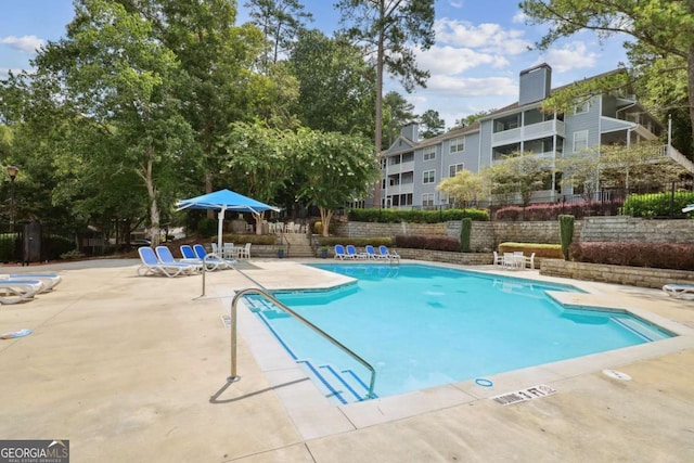 view of swimming pool with a patio