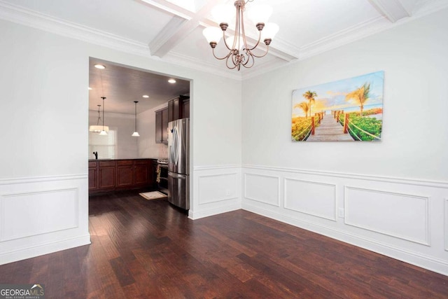 unfurnished dining area featuring beam ceiling, coffered ceiling, an inviting chandelier, dark hardwood / wood-style flooring, and ornamental molding