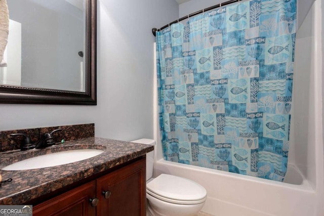 full bathroom featuring vanity, shower / bath combo, and toilet