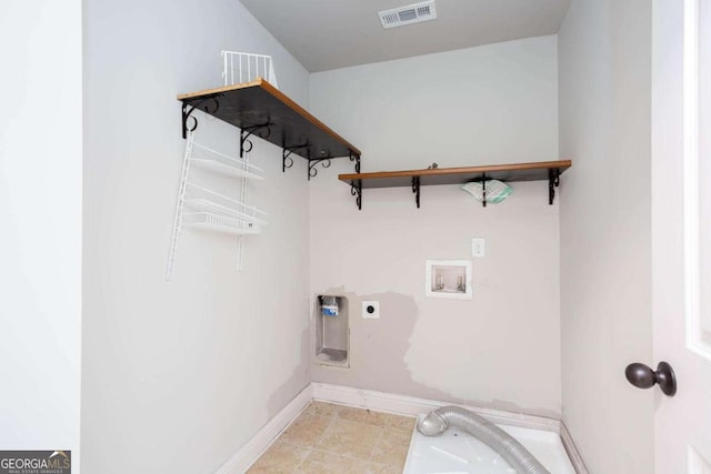 clothes washing area featuring washer hookup and electric dryer hookup