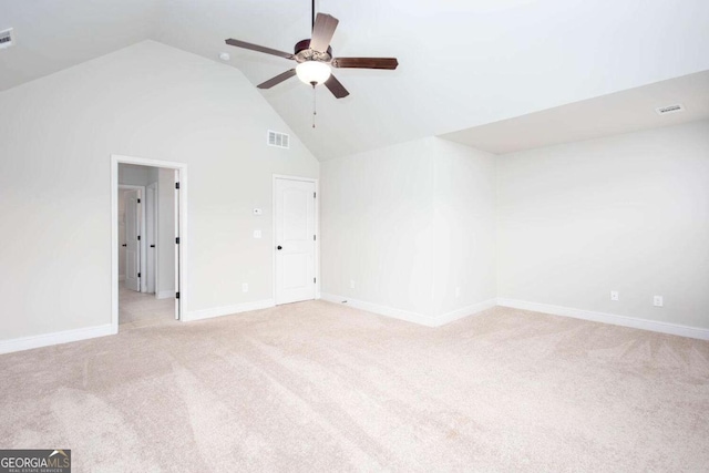 carpeted spare room with high vaulted ceiling and ceiling fan