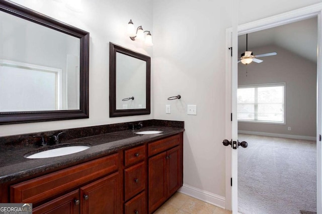 bathroom featuring vanity, vaulted ceiling, and ceiling fan