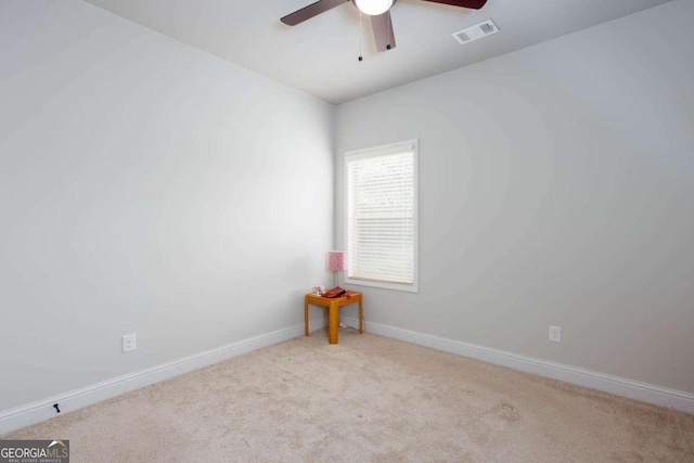 empty room with light carpet and ceiling fan