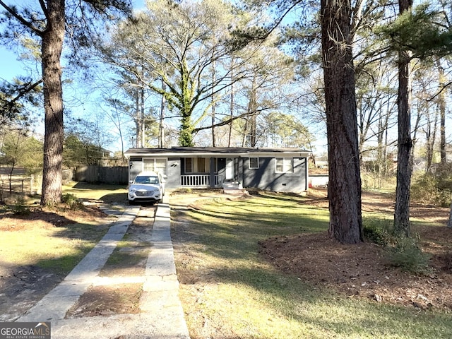 view of front of home featuring a front lawn and covered porch