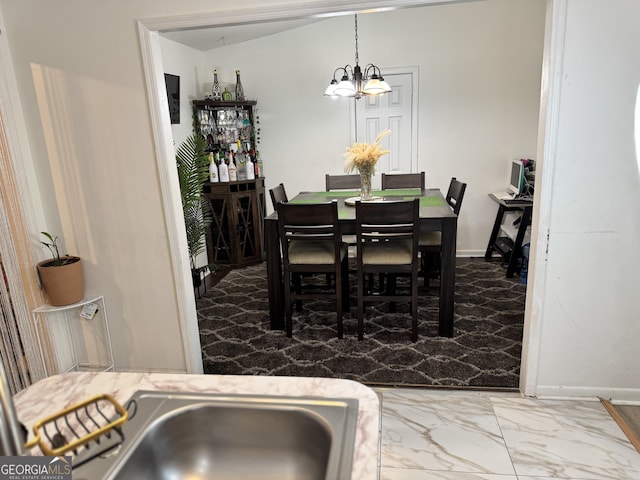 dining area featuring an inviting chandelier