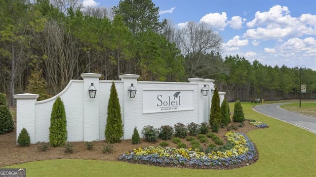 view of front of property featuring a porch, a front yard, and a garage