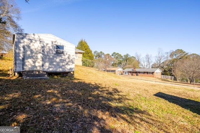 view of yard featuring a storage unit