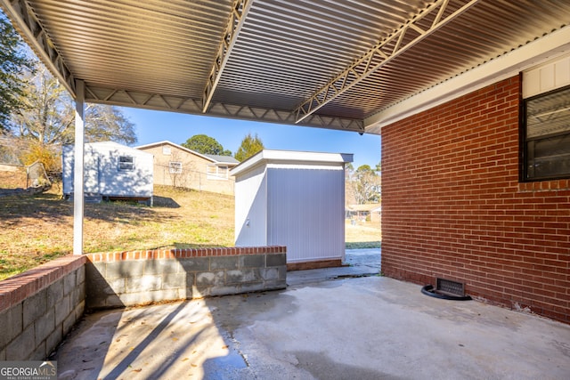 view of patio / terrace featuring a storage shed