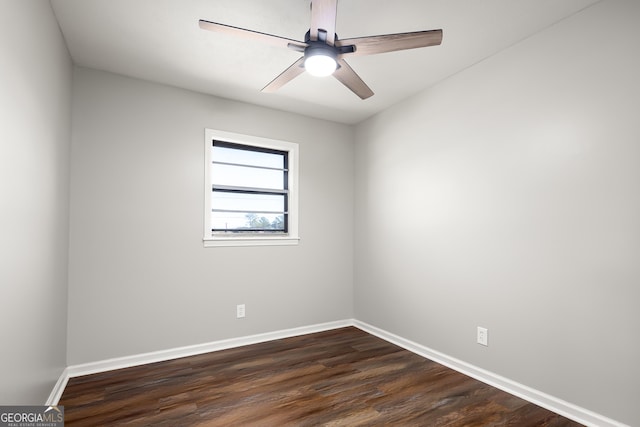 spare room with ceiling fan and dark hardwood / wood-style floors