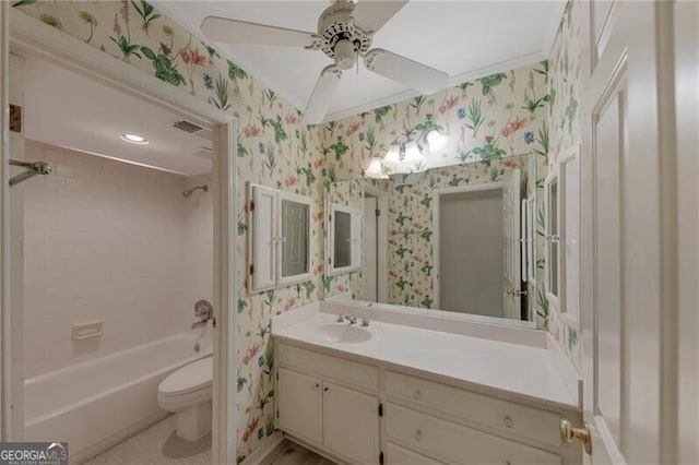 full bathroom with toilet, crown molding, vanity, ceiling fan, and shower / tub combination