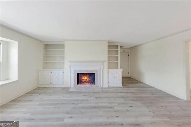 unfurnished living room with light hardwood / wood-style flooring