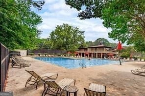 view of swimming pool with a patio