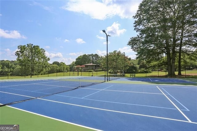 view of sport court with basketball hoop